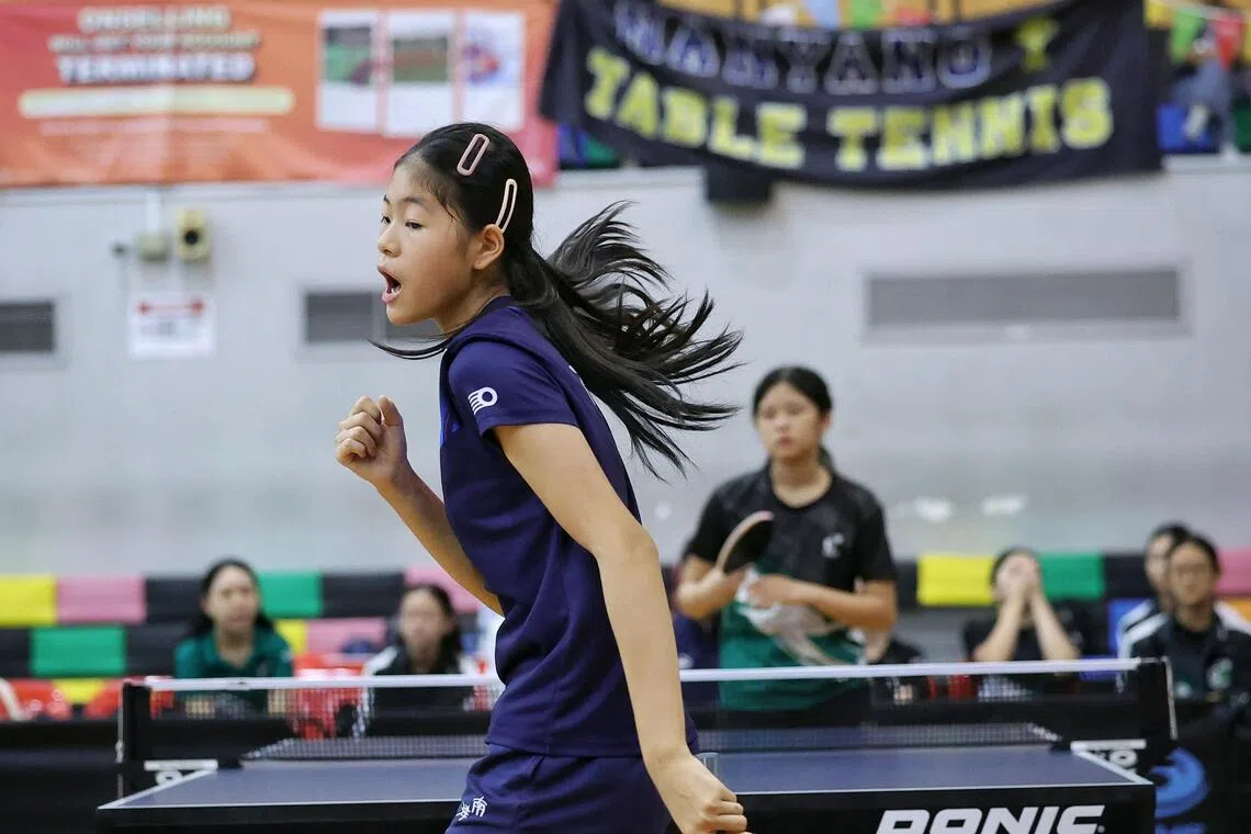 Sun Shixuan of Nanyang Girls’ High School celebrating a point won against Joly Peh of Raffles Girls’ School during the girls’ C division table tennis final at Pasir Ris Sports Hall on Aug 6.