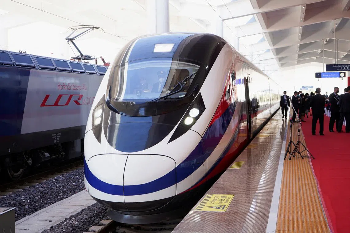 FILE PHOTO: A train is ready on the station during the handover ceremony of the high-speed rail project linking the Chinese southwestern city of Kunming with Vientiane, in Vientiane, Laos, December 3, 2021. REUTERS/Phoonsab Thevongsa/File Photo