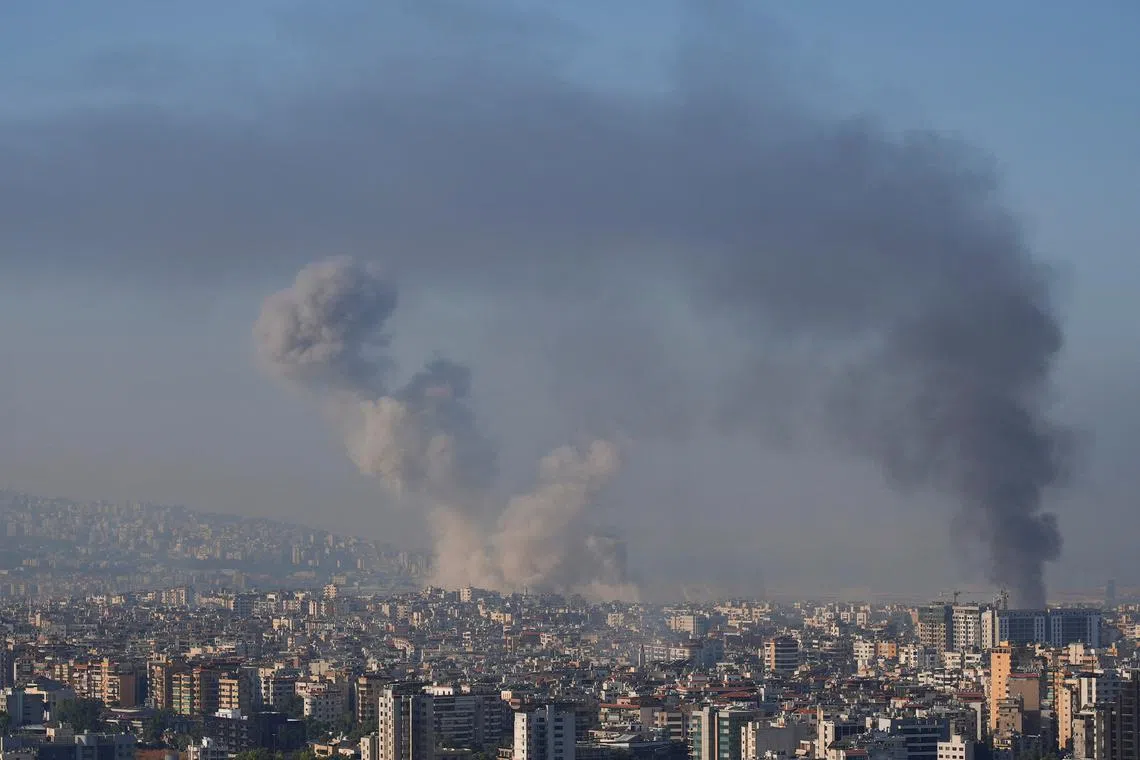 Smoke billows over Beirut's southern suburbs, amid ongoing hostilities between Hezbollah and Israeli forces, as seen from Sin El Fil, Lebanon October 5, 2024. REUTERS/Joseph Campbell