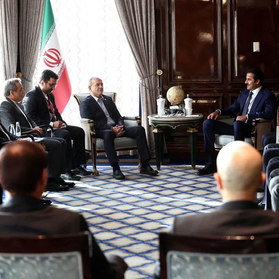Iranian President Masoud Pezeshkian meeting Qatari Emir Sheikh Tamim bin Hamad Al Thani in Moscow, Russia, on Oct 27.