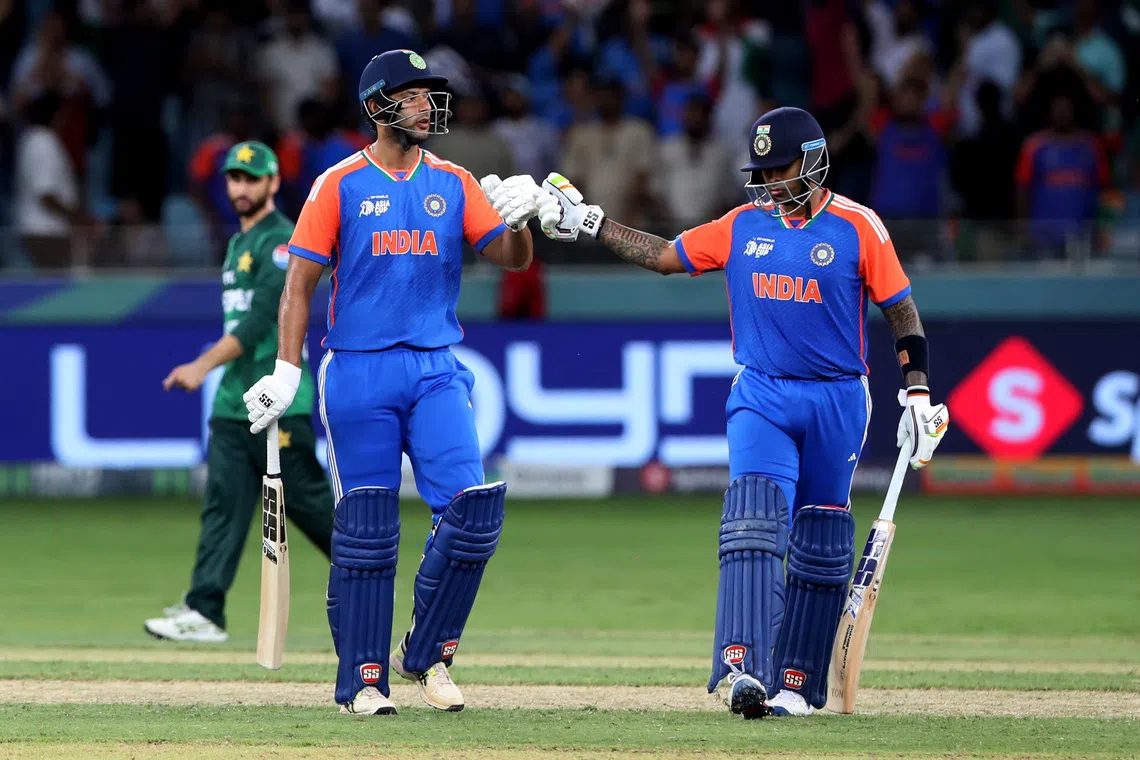 Cricket - Asia Cup - Group A - India v Pakistan - Dubai International Cricket Stadium, Dubai, United Arab Emirates - September 14, 2025 India's Suryakumar Yadav and Shivam Dube celebrate winning REUTERS/Satish Kumar
