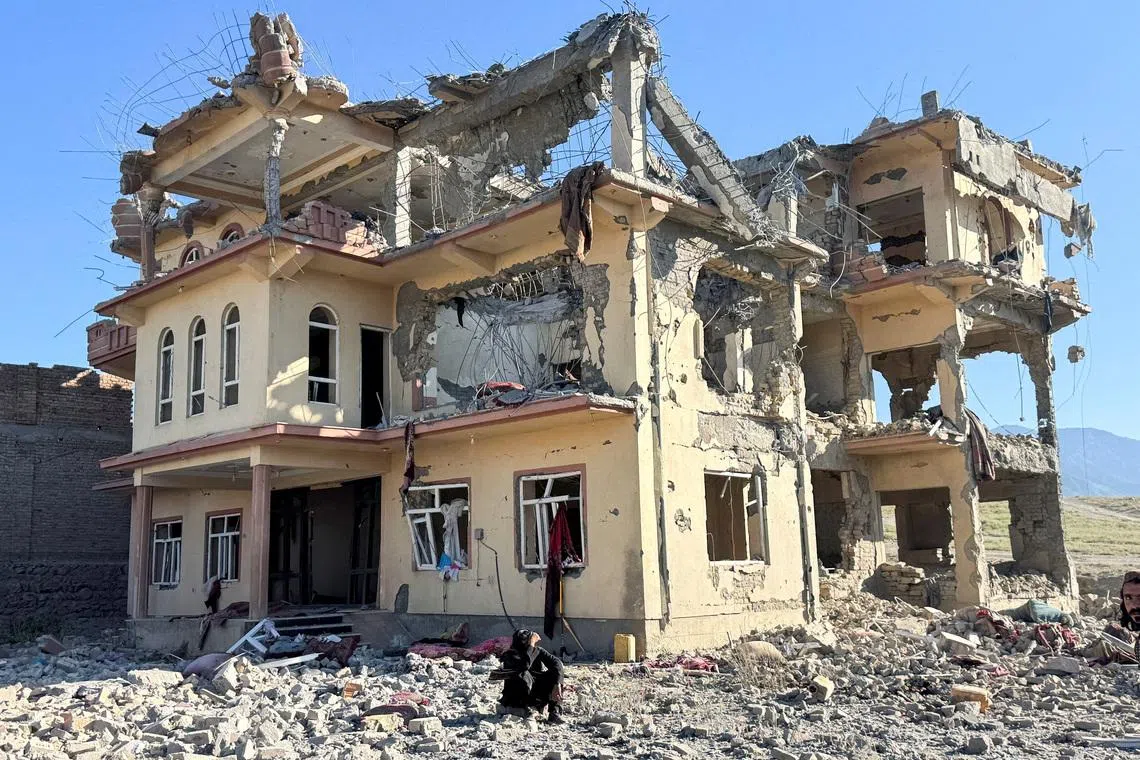 A man sits in front of a destroyed building after an attack, which the Taliban say was an airstrike carried out by Pakistan's security forces, in Samkani District, Paktia Province, Afghanistan, June 29, 2026. REUTERS/Stringer TPX IMAGES OF THE DAY