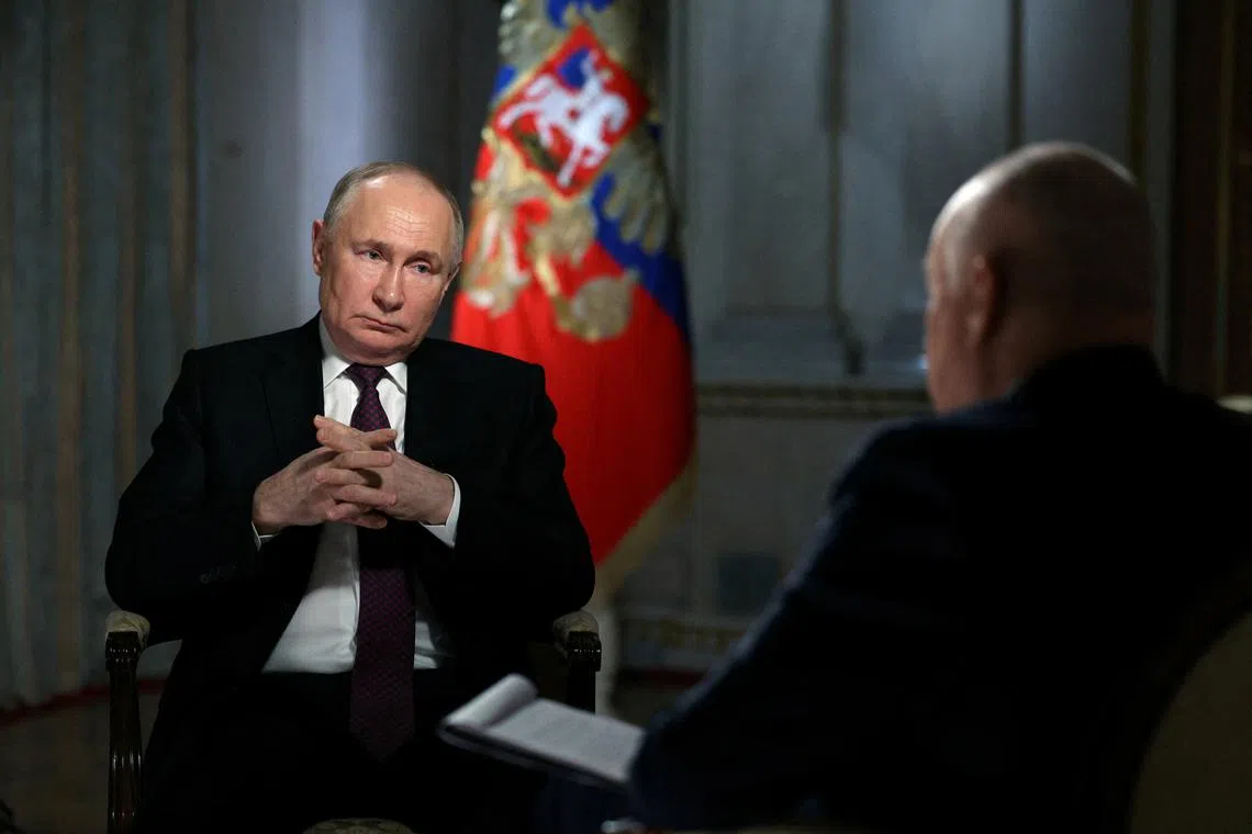 FILE PHOTO: Russian President Vladimir Putin speaks with Director General of Rossiya Segodnya media group Dmitry Kiselyov during an interview in Moscow, Russia, March 12, 2024. Sputnik/Gavriil Grigorov/Pool via REUTERS/File Photo