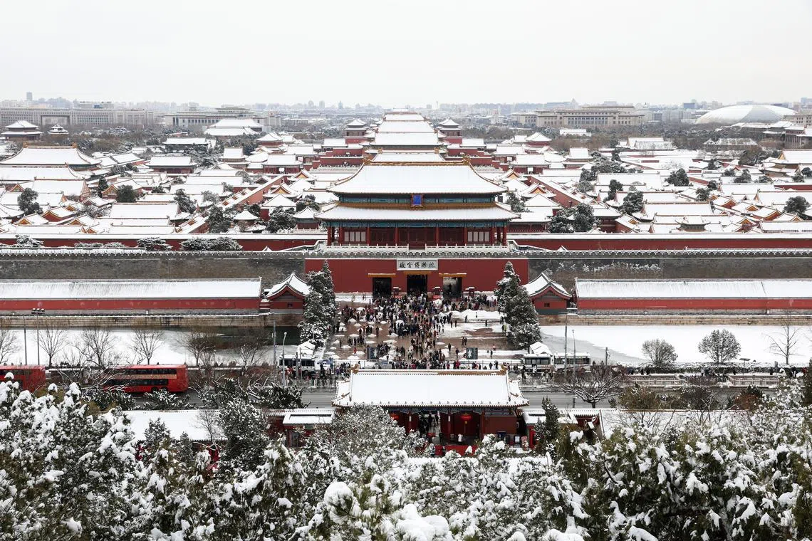 Snow blankets the Forbidden City in Beijing as seen from Jingshan Park.