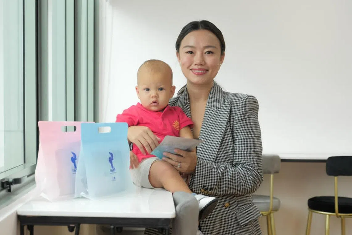Ms Yang Mei, 37, with her son Leo Lumediluna. She sends her breast milk to be freeze-dried at BioAcumen Global. 