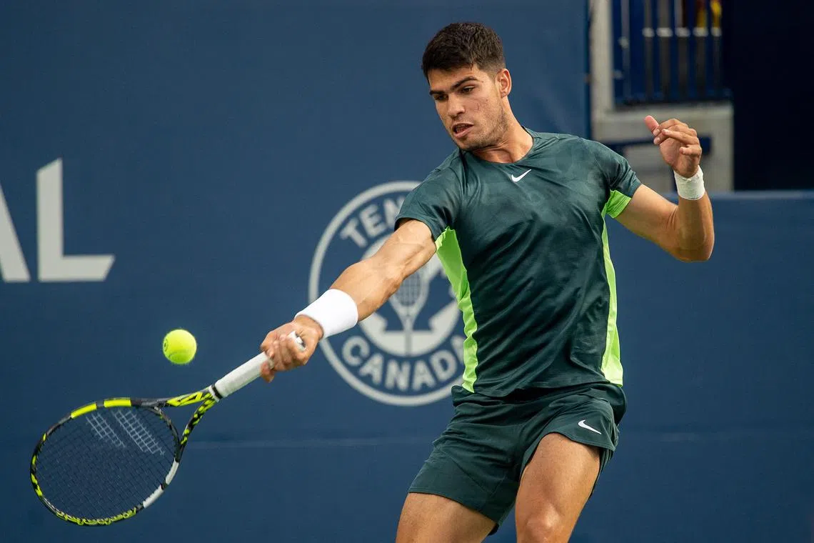 epa10792648 Carlos Alcaraz of Spain in action against Ben Shelton of the USA during the men's second round match at the 2023 National Bank Open tennis tournament in Toronto, Canada, 09 August 2023.  EPA-EFE/EDUARDO LIMA