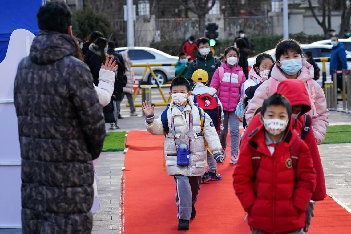 Classes in some schools were suspended in Hangzhou, Shanghai, Beijing and Tianjin after students tested positive for Covid-19 and the flu.