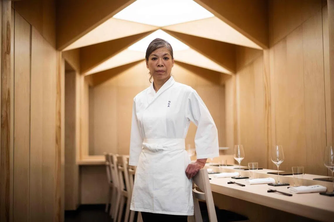 Japan's Chizuko Kimura, the first woman in the world to be awarded a star by the Guide Michelin as a sushi chef, poses during a photo session at her restaurant Sushi Shunei in Paris, on April 7, 2025. The 54-year-old Japanese chef Chizuko Kimura, regained the Michelin star that her late husband Shunei Kimura won three years ago for their Sushi Shunei restaurant in Paris. Shunei Kimura died from cancer three months later, aged 65. The following year, the restaurant lost its star. Now Chizuko Kimura's goal is to surpass her husband's achievements as a tribute to his work and his memory. (Photo by JULIEN DE ROSA / AFP)