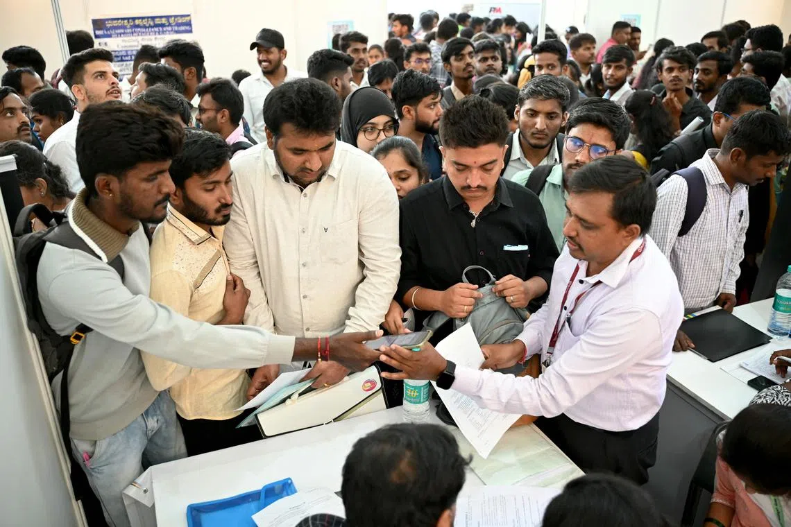 Job seekers attend a walk-in-interview during a state-level job fair organised by India's Karnataka state government at the Palace Grounds in Bengaluru on February 26, 2024. (Photo by Idrees MOHAMMED / AFP)