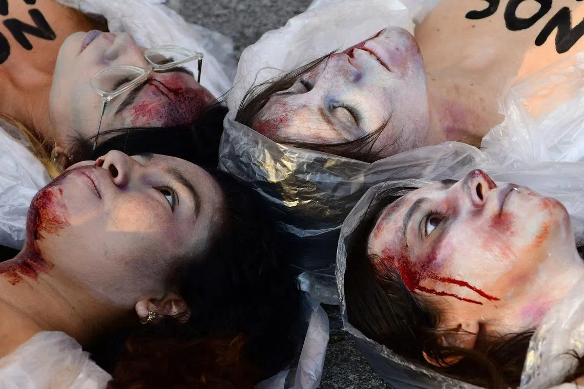 In this file photo taken on Feb 08, 2019, members of feminist movement Femen protest against the violence against women in front of the Ministry of Equality in Madrid, Spain.