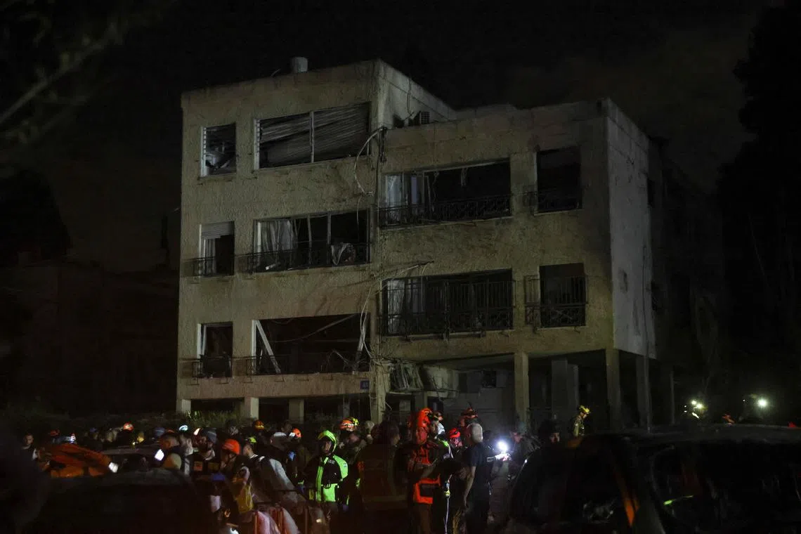 Emergency personnel operate after missiles were launched from Iran to Israel, in Haifa, Israel, on June 15, 2025.