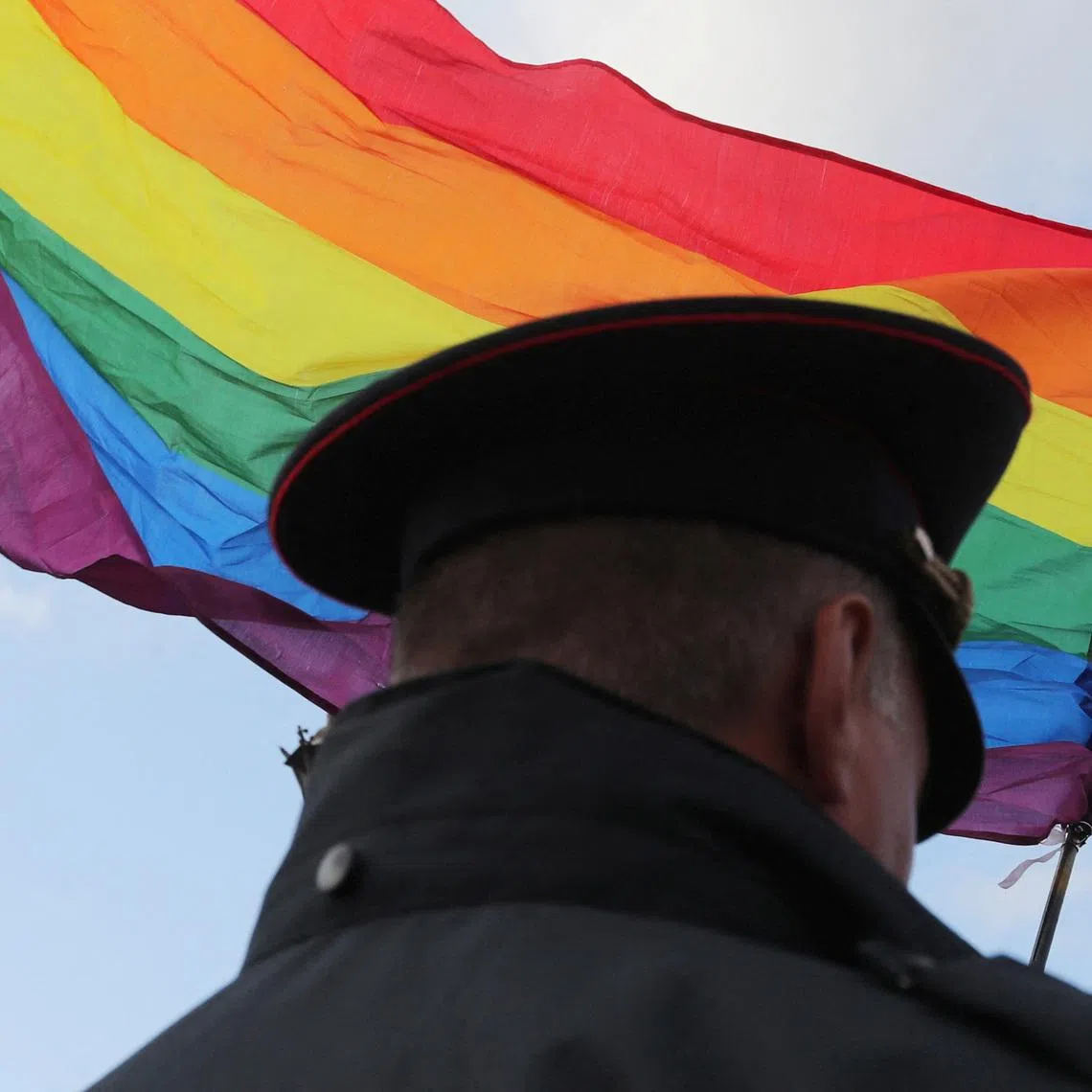 FILE PHOTO: A law enforcement officer stands guard during the LGBT community rally \"X St.Petersburg Pride\" in central Saint Petersburg, Russia August 3, 2019. REUTERS/Anton Vaganov/File Photo