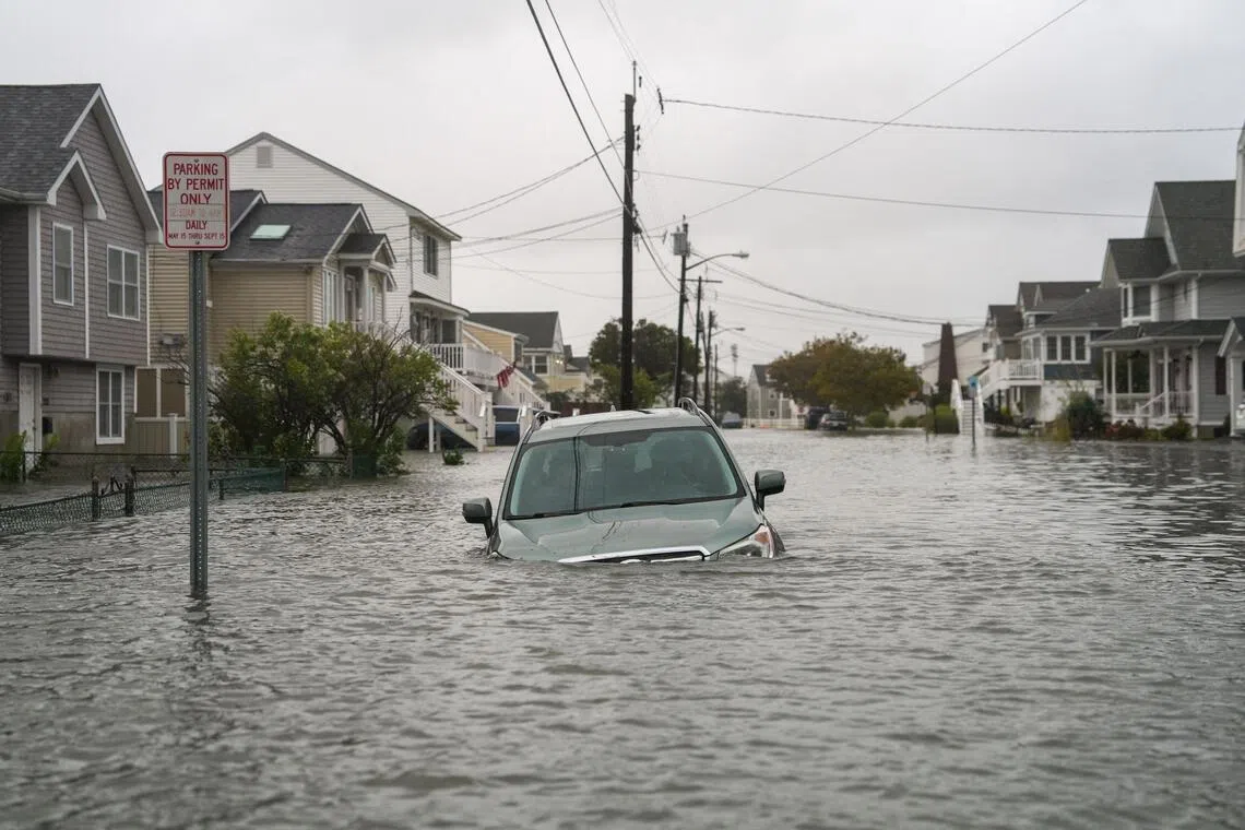 A submerged car is seen amid floods in Point Pleasant, New Jersey.