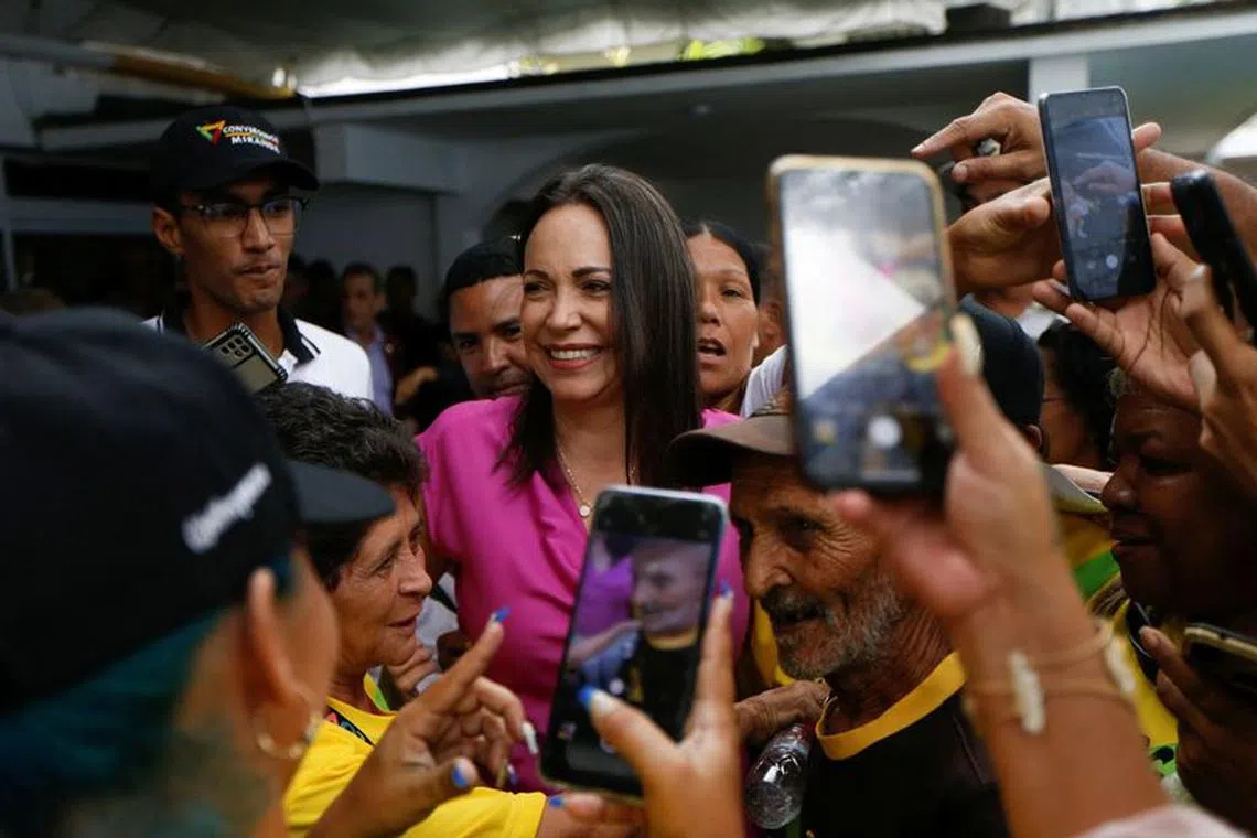 Maria Corina Machado, candidate of the Vente Venezuela party for the opposition primaries, meets with her supporters after a press conference, in Caracas, Venezuela September 6, 2023. REUTERS/Leonardo Fernandez Viloria/File Photo