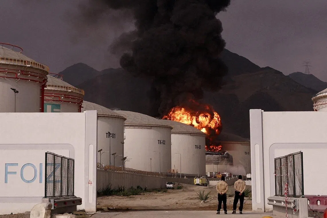 FILE PHOTO: Fire and smoke rise in the Fujairah oil industry zone, caused by debris after interception of a drone by air defenses, according to the Fujairah media office, amid the U.S.-Israel conflict with Iran, in Fujairah, United Arab Emirates, March 4, 2026. REUTERS/Amr Alfiky/File Photo
