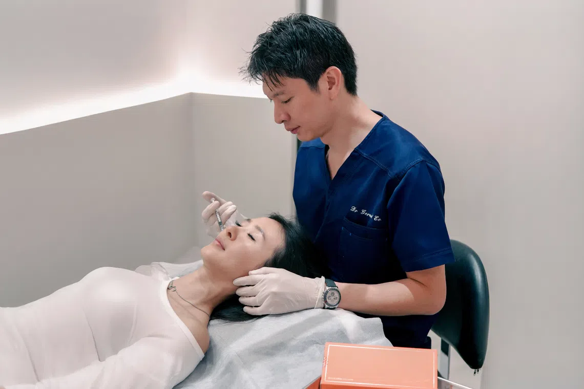 Asian woman getting an ECM Skin Booster injectable from Dr Gerard Ee from Clifford Clinic 