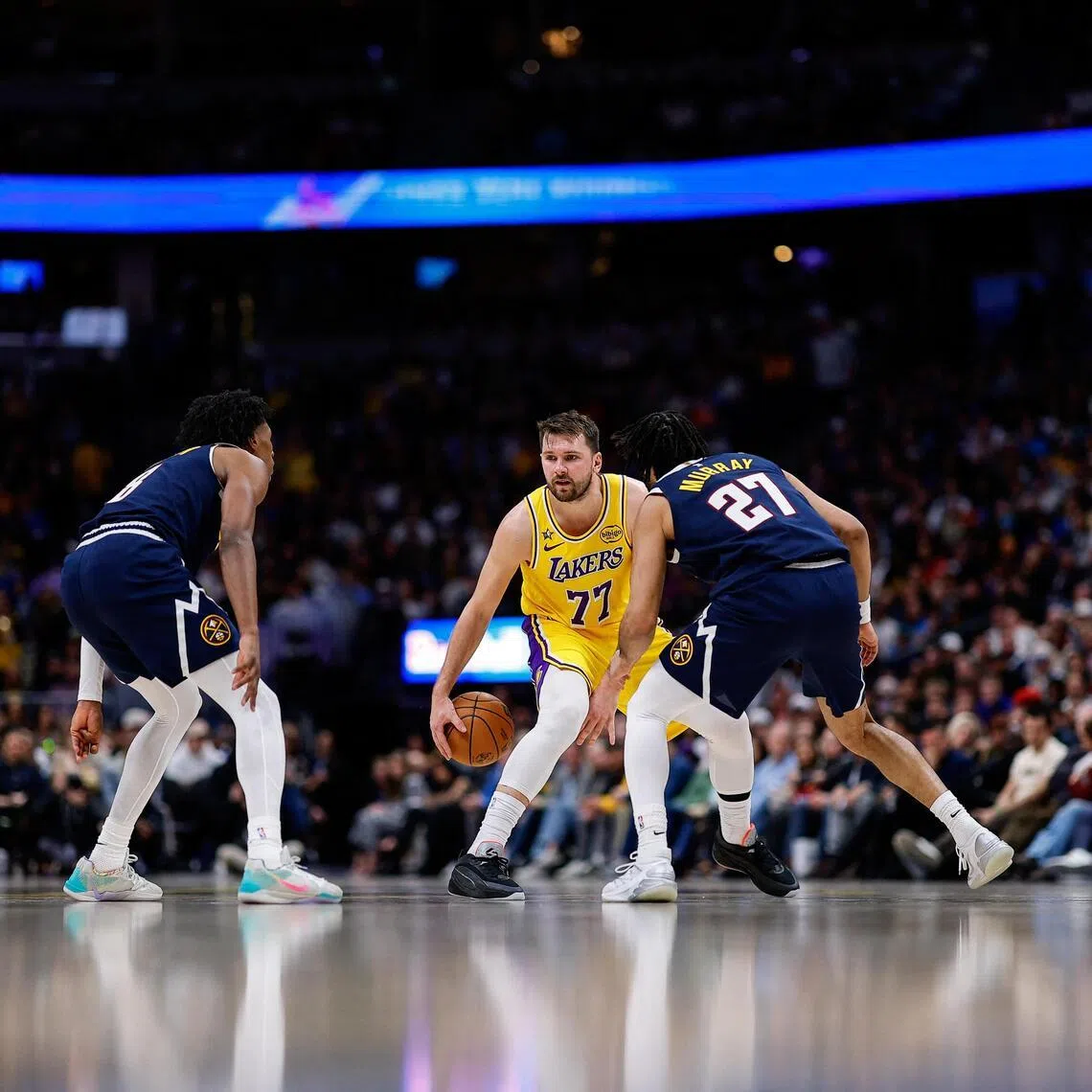 Los Angeles Lakers guard Luka Doncic controls the ball against the Denver Nuggets in the fourth quarter at Ball Arena.