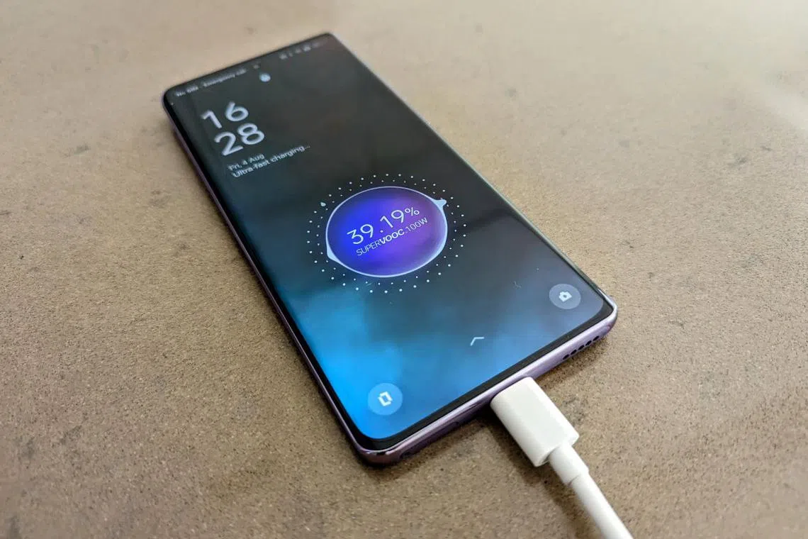 The Oppo Reno10 Pro+ and its Supervooc fast charging brick. 