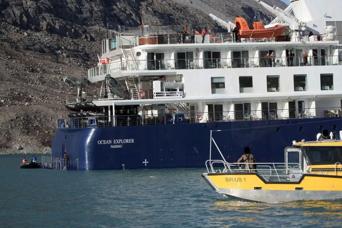 FILE PHOTO: View of the Ocean Explorer, a luxury cruise ship carrying 206 people that ran aground, in Alpefjord, Greenland, September 13, 2023.  Danish Air Force/Arctic Command/Handout via REUTERS/File photo