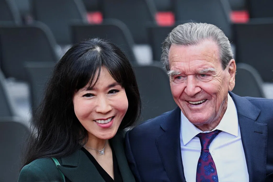 Former German Chancellor Gerhard Schroeder and his wife So-yeon Schroeder-Kim attend the event on the occasion of the 75th anniversary of the German Basic Law in front of the Chancellery in Berlin, Germany May 23, 2024. REUTERS/Annegret Hilse/ File Photo