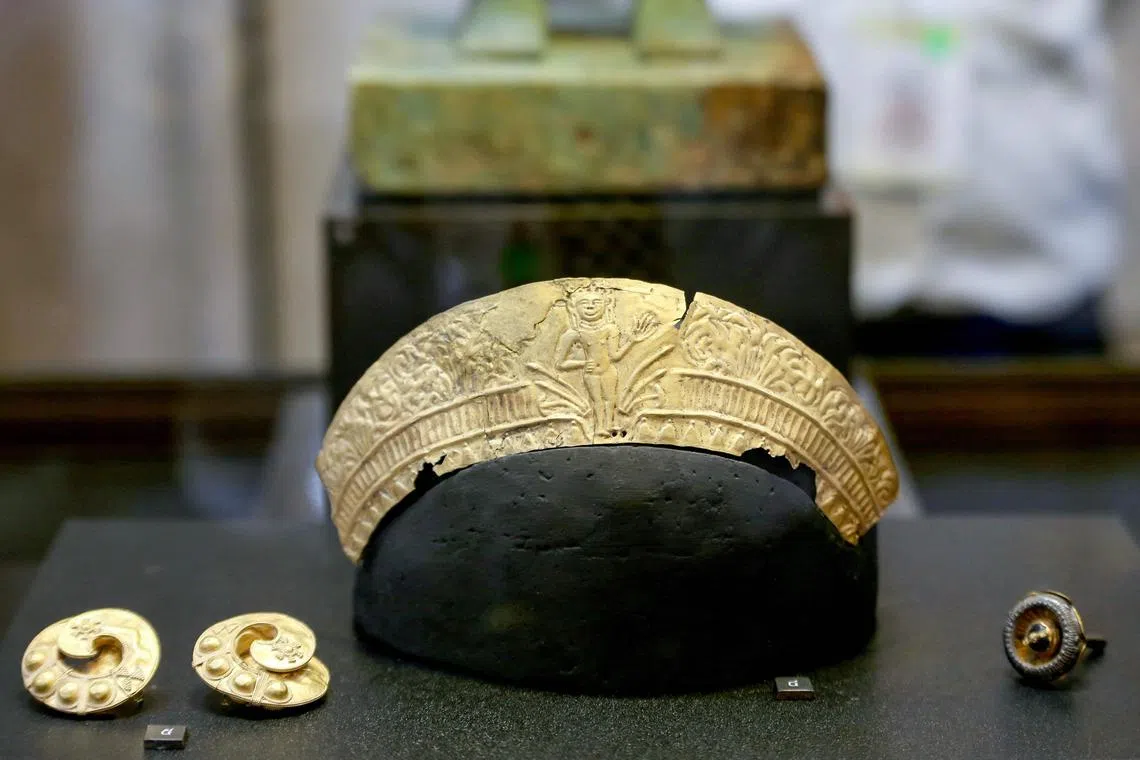 The items, which include gold crowns and necklaces, are expected to go on display at the national museum.