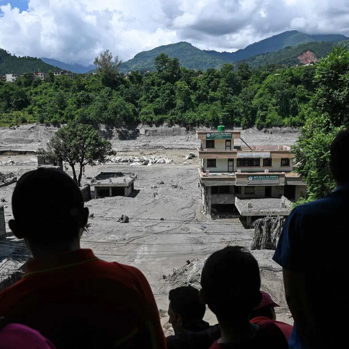 More than 1,300 people are missing on Aug 27, a day after flash floods and landslides along the Nepal-Tibet border killed at least 270, sweeping away entire villages.