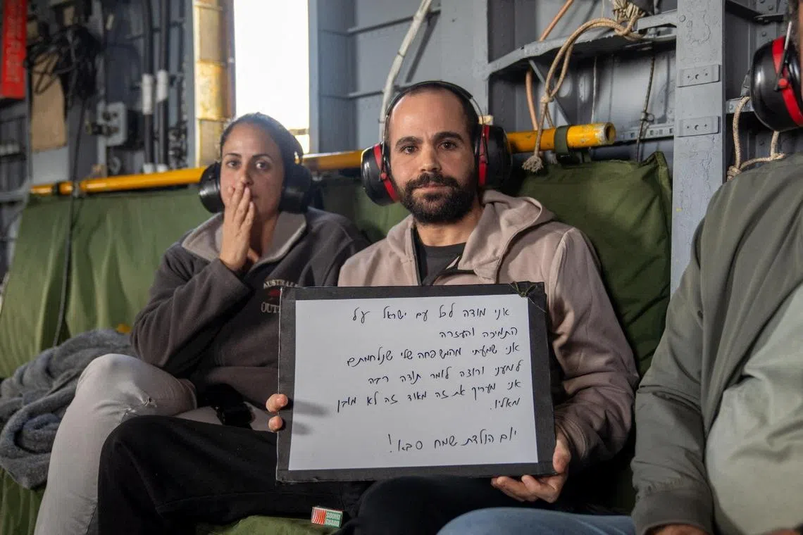 Released Israeli hostage, Yarden Bibas, who was seized during the deadly October 7, 2023 attack by Hamas, holds a whiteboard with the message "I thank all the people of Israel for the support and help."
