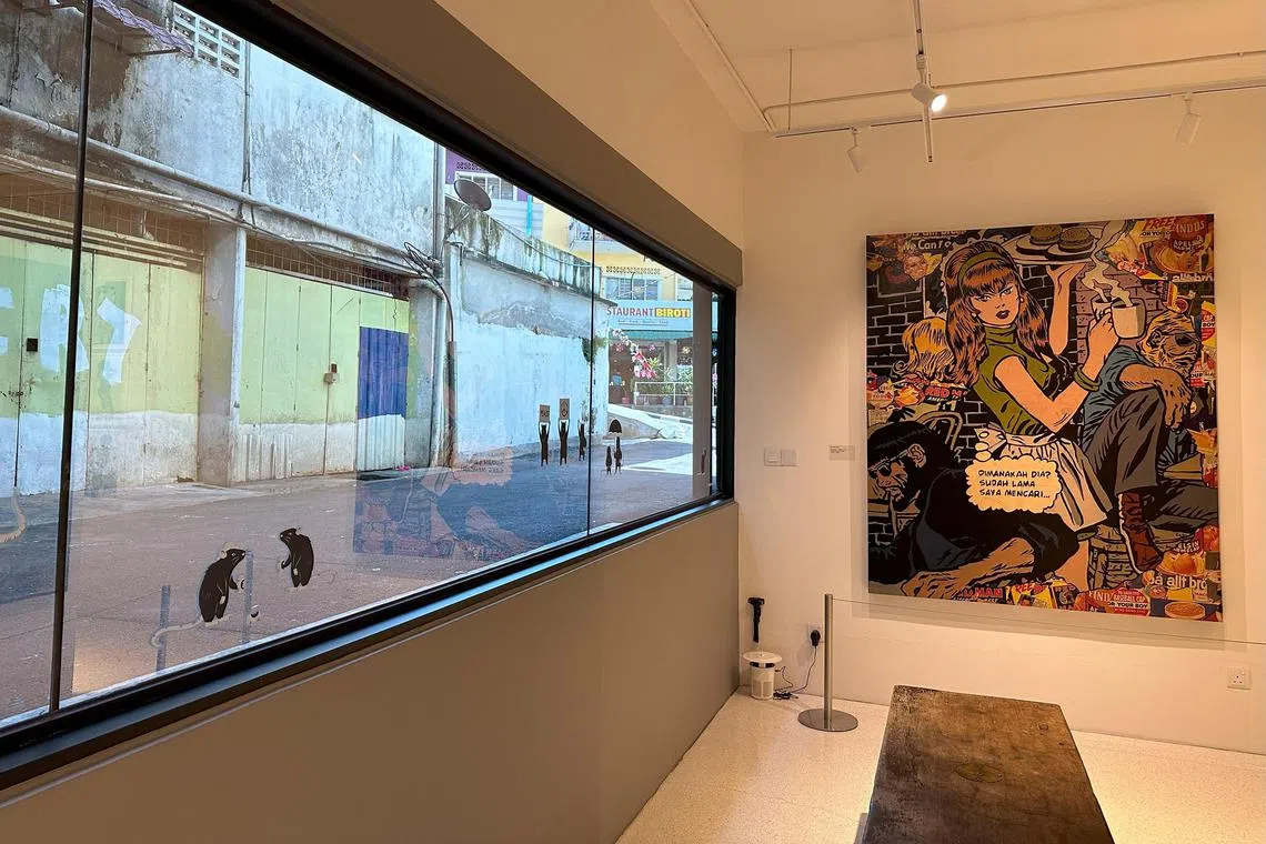 A large picture window at Ur-Mu frames a grotty back alley. 
 