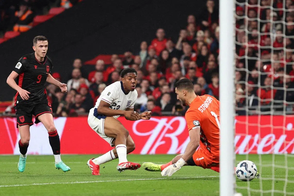 England's Myles Lewis-Skelly scores their first goal past Albania's Thomas Strakosha.
