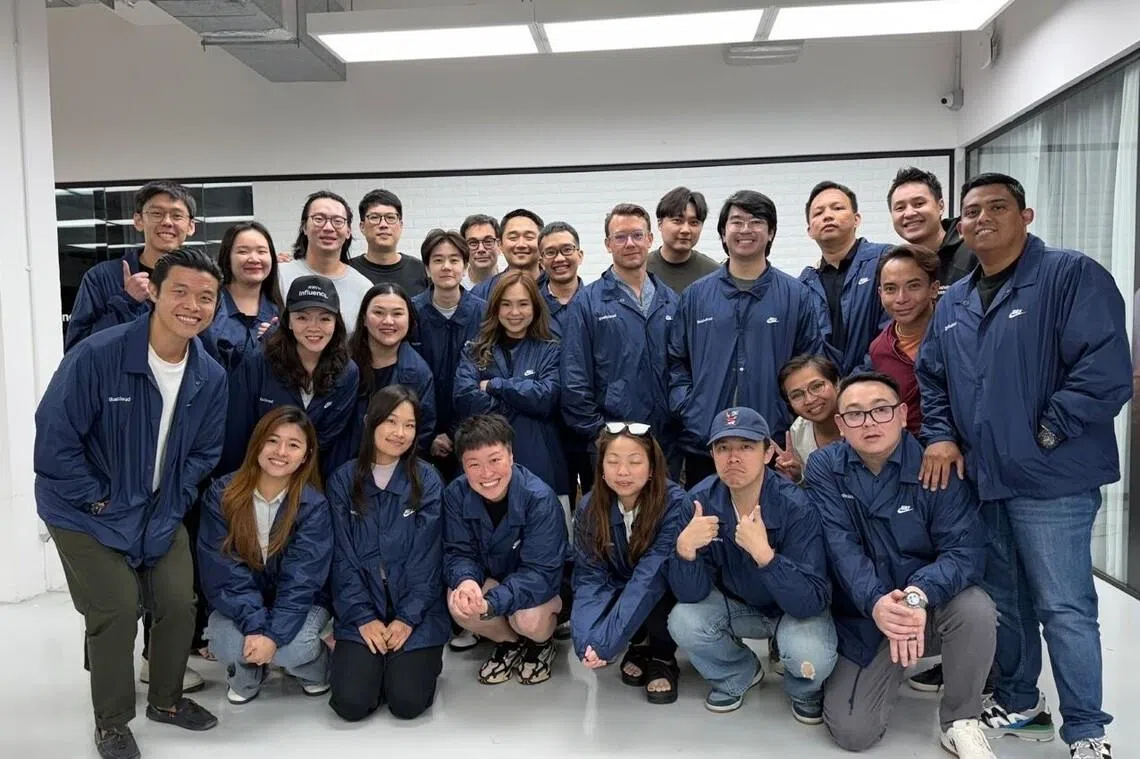 Gushcloud chief financial officer Andrew Lim with his colleagues