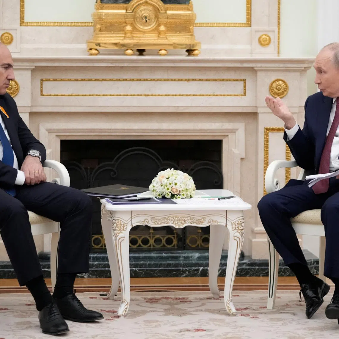 Russian President Vladimir Putin talks to Armenian Prime Minister Nikol Pashinyan during their meeting at the Kremlin in Moscow, Russia, April 1, 2026. Pavel Bednyakov/Pool via REUTERS