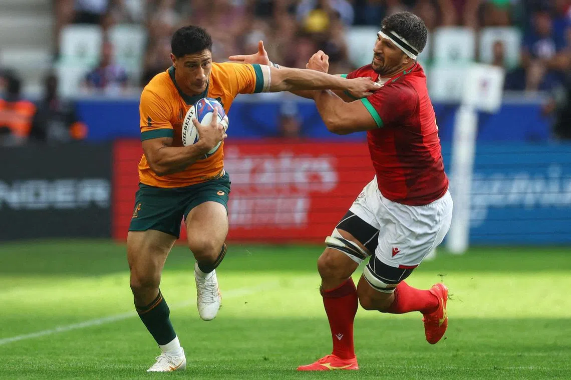 Australia's Lalakai Foketi in action with Portugal's Thibault de Freitas during the 2023 Rugby World Cup.