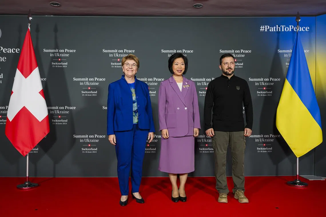 Swiss Federal President Viola Amherd (left) poses with Special envoi of Prime minister Ann Sim of Singapore (center) and President Volodymyr Zelenskyy of Ukraine (right) during the Summit on peace in Ukraine, in Stansstad near Lucerne, Switzerland, Saturday, June 15, 2024. Heads of state from around the world gather on the Buergenstock Resort in central Switzerland for the Summit on Peace in Ukraine, on June 15 and 16. (KEYSTONE/EDA/POOL/Alessandro della Valle)