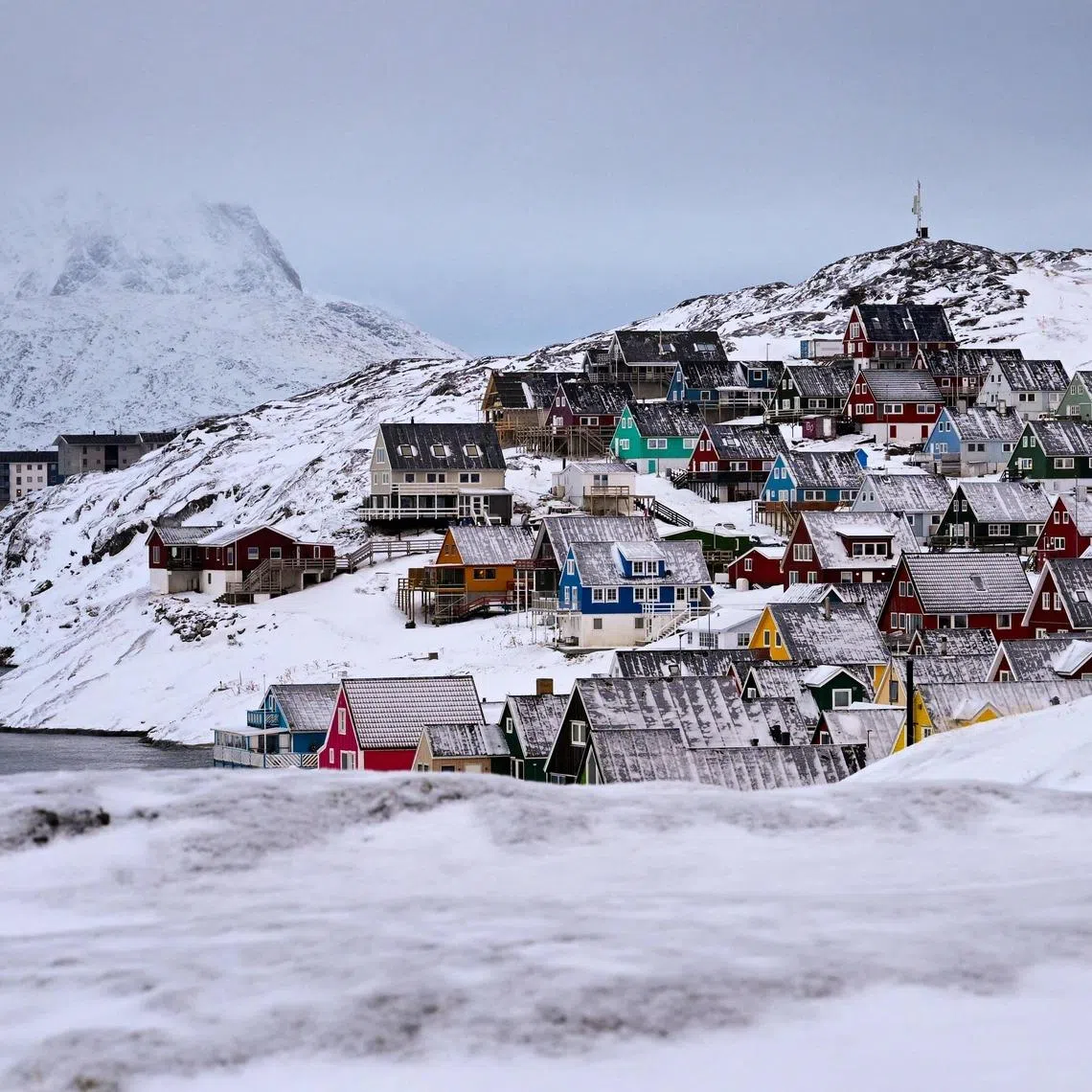 TOPSHOT - Houses of the old town are pictured in Nuuk, western Greenland, on February 4, 2026. (Photo by Ina FASSBENDER / AFP)