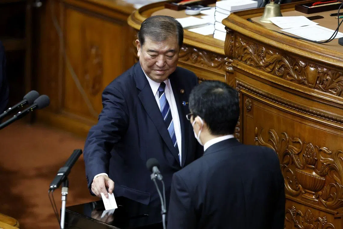 Mr Shigeru Ishiba, president of the ruling Liberal Democratic Party (LDP), casts his ballot for the nomination of Japan's Prime Minister in the Lower House of Parliament on Oct 1, 2024.