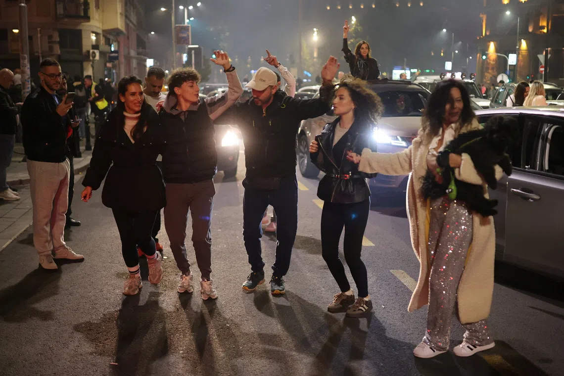 Supporters of the electoral list \"Student List - Students Win\" celebrate after long-time ruler Aleksandar Vucic conceded defeat in the parliamentary election, in Belgrade, Serbia, October 25, 2026. REUTERS/Djordje Kojadinovic