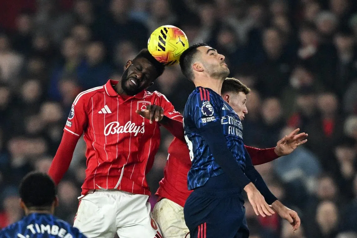 Soccer Football - Premier League - Nottingham Forest v Arsenal - The City Ground, Nottingham, Britain - January 17, 2026 Nottingham Forest's Ibrahim Sangare in action with Arsenal's Mikel Merino REUTERS/Dylan Martinez