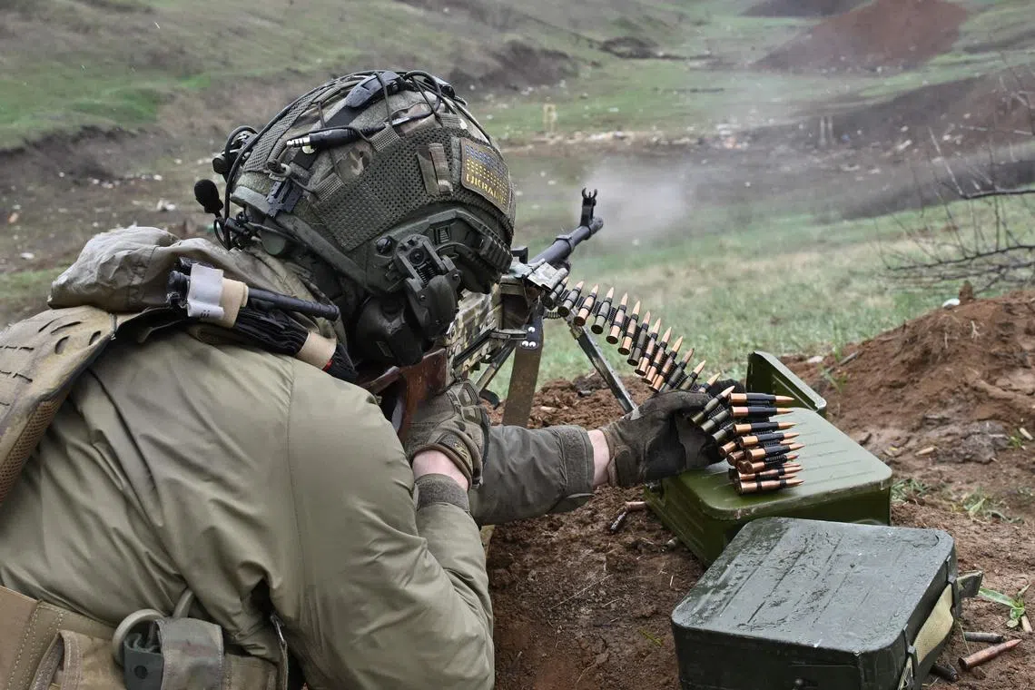A Ukrainian Special Forces Serviceman fires a weapon during a training exercise in Donetsk region.
