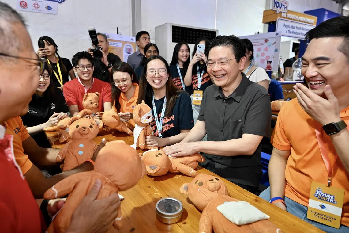 Prime minister Lawrence Wong interacting with youths during the launch of the PA Youth Charter at the Future of Youth at Ngee Ann City Civic Plaza on March 1, 2025.