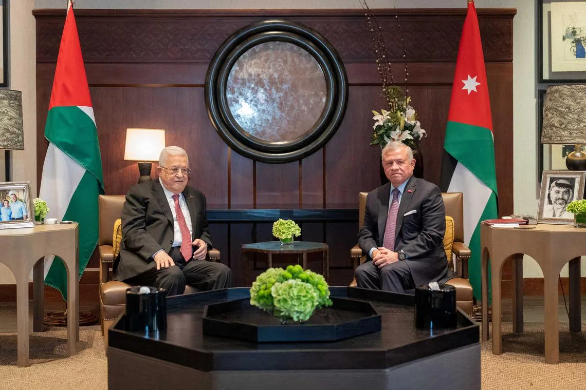 Jordan's King Abdullah II (right) meets with Palestinian President Mahmoud Abbas in Amman, Jordan, on Oct 12.