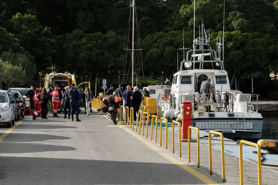 Paramedics and coast guard officers transfer the bodies of migrants following a collision off the island of Rhodes, Greece, December 20, 2024. Argyris Mantikos/Eurokinissi via REUTERS