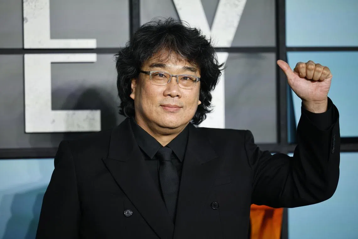 South Korean director Bong Joon-ho waves as he arrives for the world premiere of the film Mickey 17 in Leicester Square, London, on Feb 13.