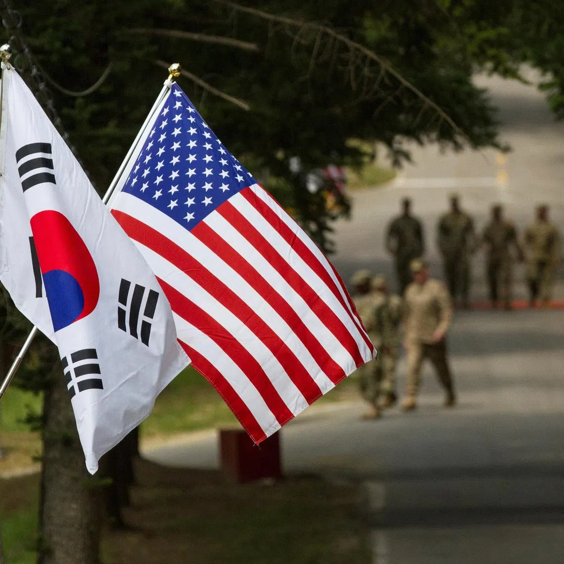 The South Korean and American flags fly next to each other at Yongin, South Korea, August 23, 2016. Courtesy Ken Scar/U.S. Army/Handout via REUTERS