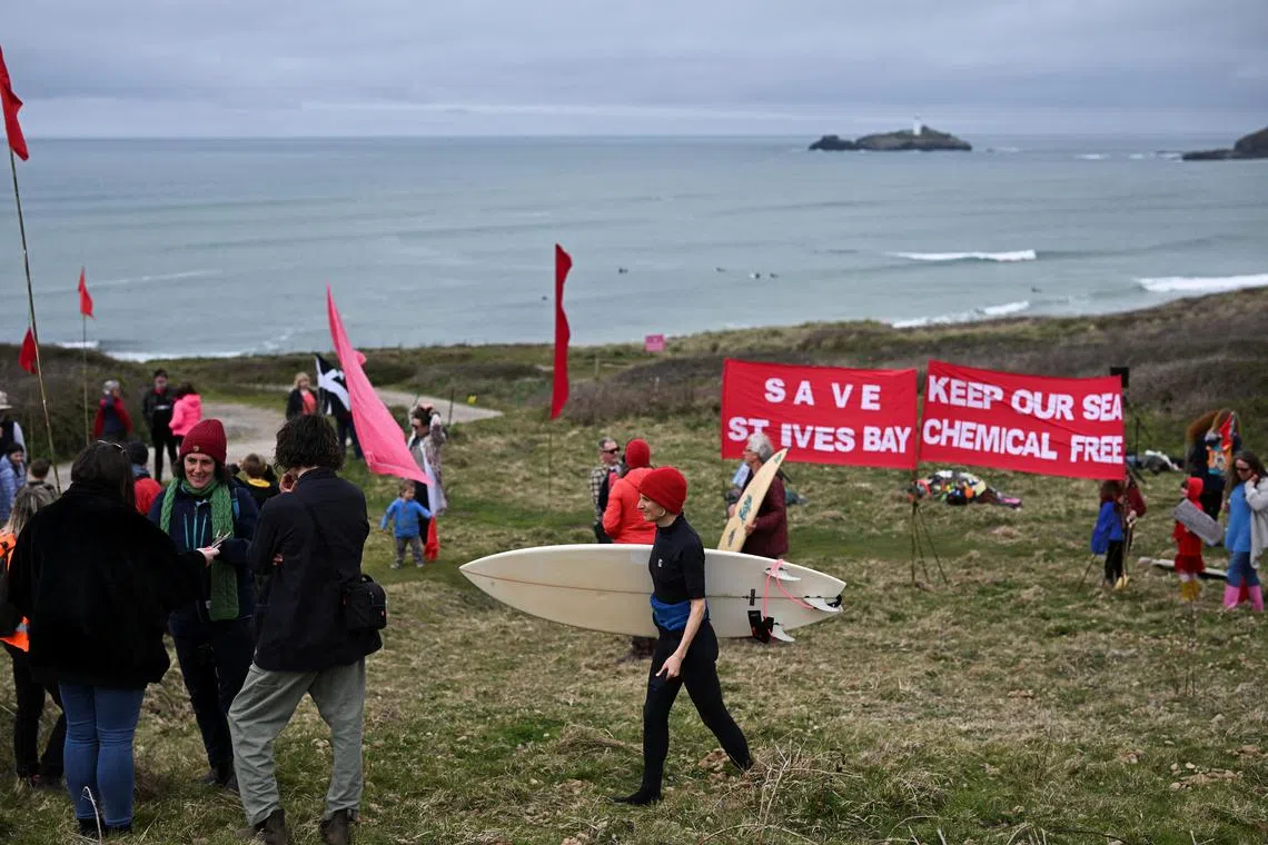 People attend a demonstration to stop chemical sewage dumps at Gwithian Beach, St. Ives, Cornwall, Britain.