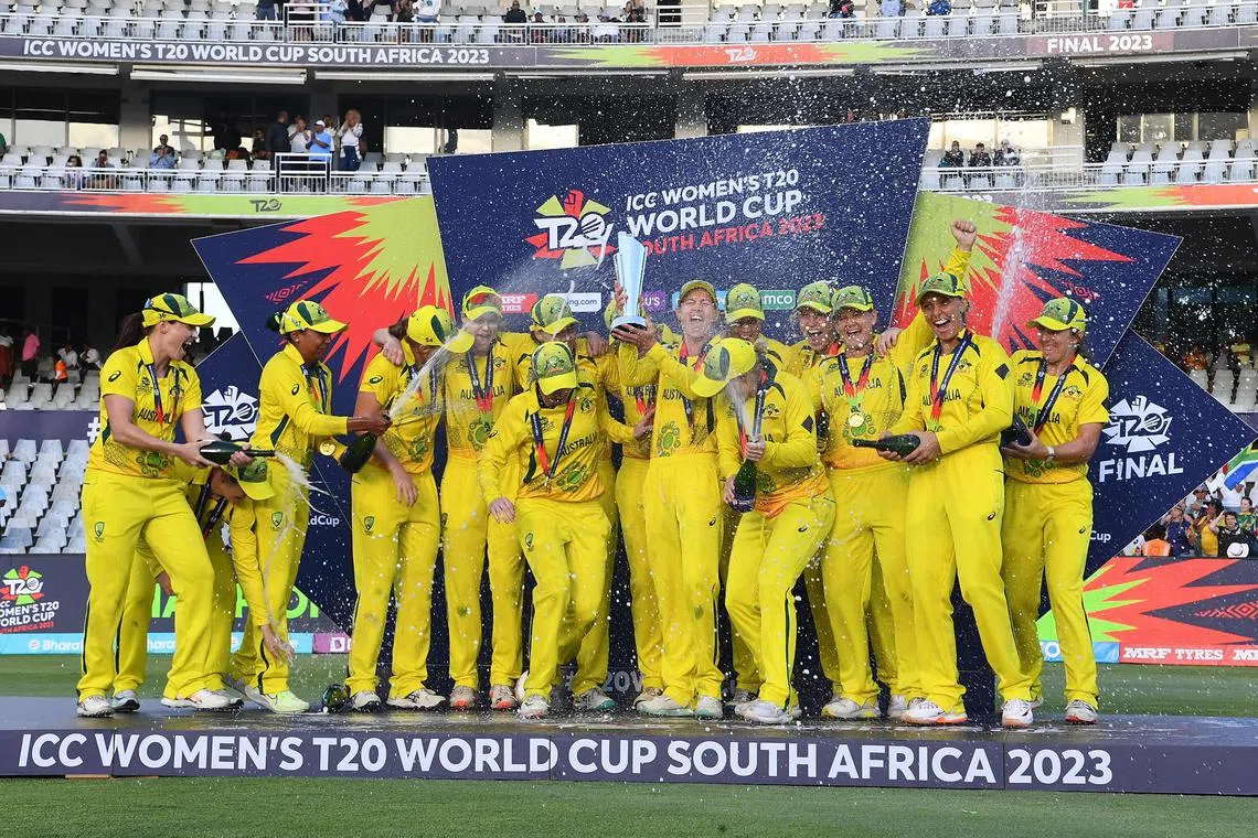 Australia's captain Meg Lanning holding the trophy with her teammates after they won the final T20 Women's World Cup cricket match against South Africa at Newlands Stadium in Cape Town on Sunday.
