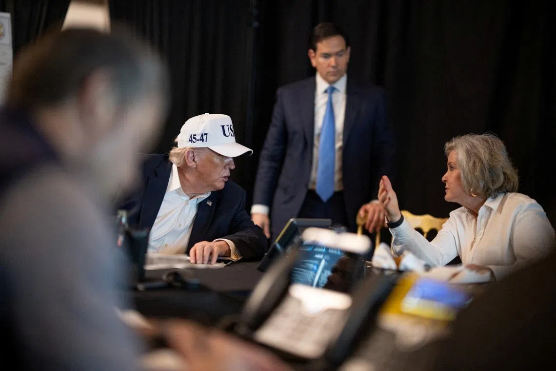 US President Donald Trump speaking with White House Chief of Staff Susie Wiles and Secretary of State Marco Rubio at his Mar-a-Lago resort in Palm Beach, Florida, on Feb 28, 2026.