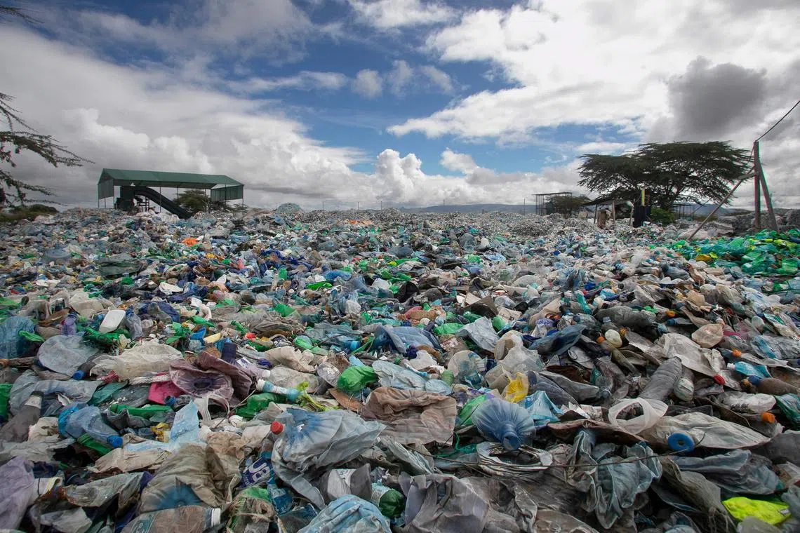 A mound of plastic waste scavenged from various environments including river channels and dump sites sit in the yard at T3 (EPZ) Limited, a recycling and repurposing factory in Athi River town, Machakos county on November 13, 2023. Negotiations to discuss concrete measures to combat plastic pollution began in Kenya at the opening of the third session of the Intergovernmental Negotiating Committee (INC-3) to develop an international legally binding instrument on plastic pollution at the United Nations Office in Nairobi (UNON). (Photo by Tony KARUMBA / AFP)