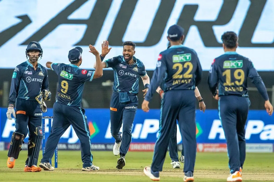 Hardik Pandya (far right) with Gujarat Titans teammates going up against Rajasthan Royals by seven wickets in the Indian Premier League (IPL) final on June 29, 2022. 