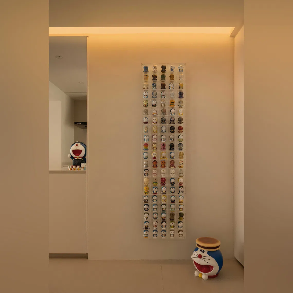 A Doraemon display greets visitors at the door of this five-room flat in Toa Payoh.