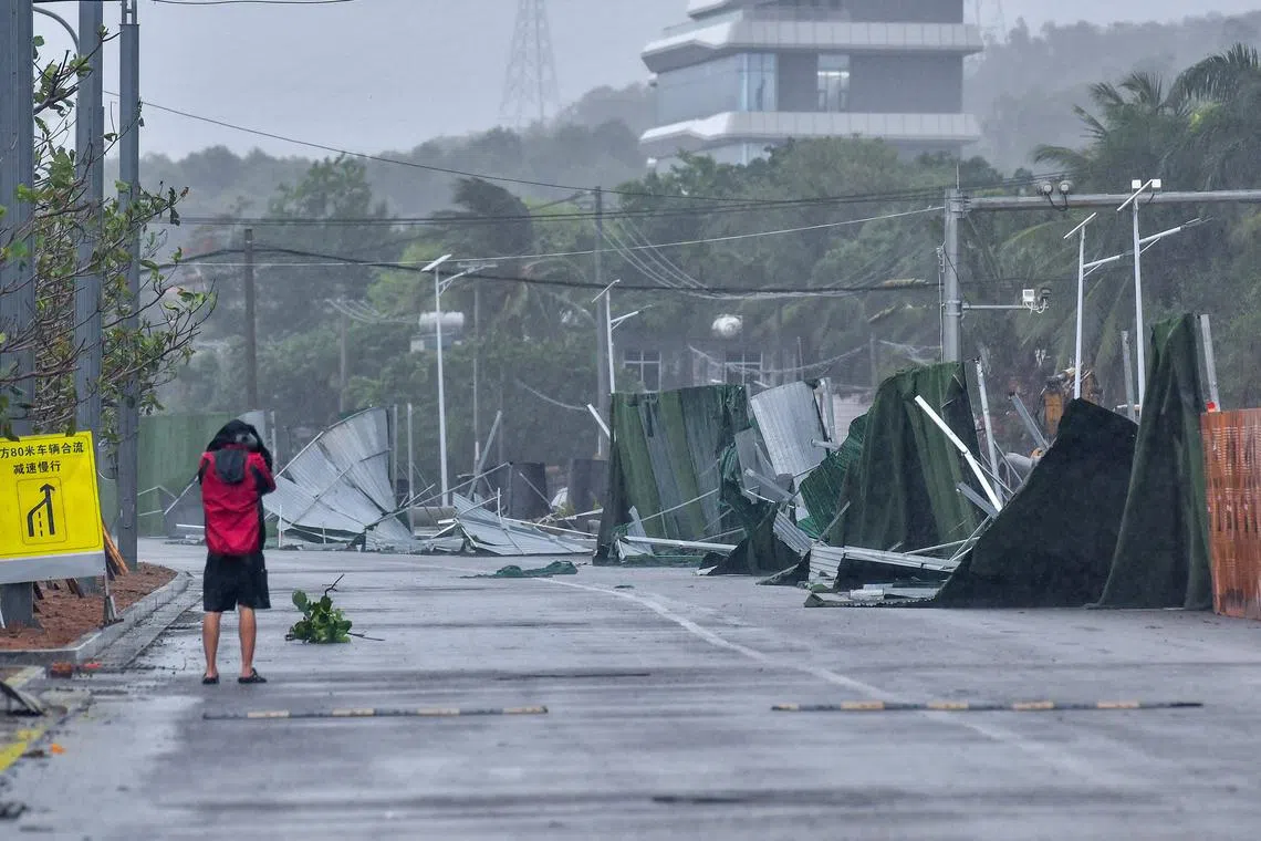 A damaged wall is seen as Typhoon Wutip approaches in Sanya, on June 13. Since July, record rainfall has lashed China's north and south.